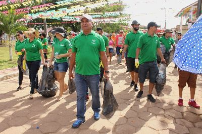 notícia: Servidores da Agência de Fomento do governo realizam ação ambiental  na Festa de São Tiago